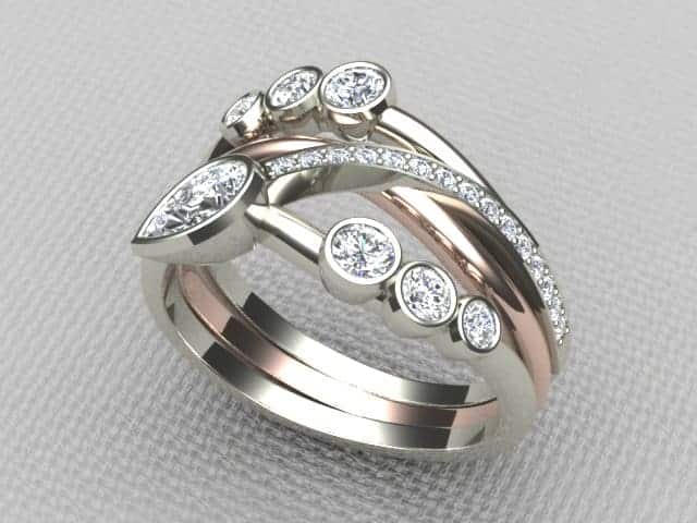 Amie is a Bespoke Diamond Ring designed as a Three Wave Signature Brook Wave Ring with Pear Shape & Brilliant Cut Diamonds with Pave set Diamonds to add extra sparkle.