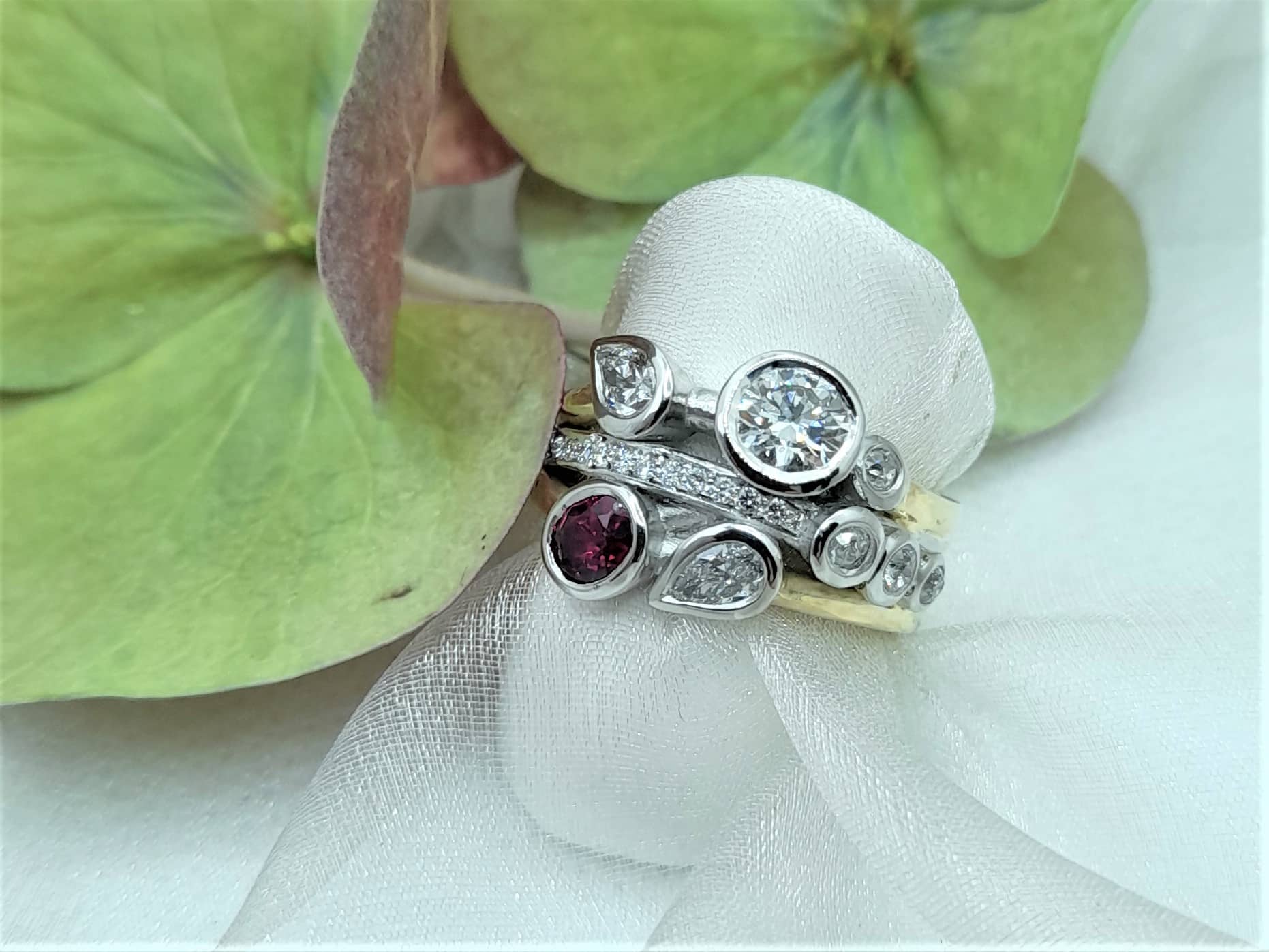 Janet is a Bespoke Diamond Ring designed as a Signature Brook Wave Ring worn as a right hand ring in 18ct gold & platinum by Pearl Perfect.